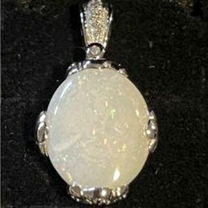 Large Opal (3.50 TCW) pendant accented with diamonds set in 10K white gold